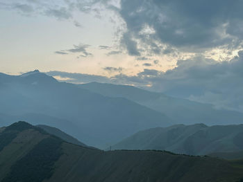 Scenic view of mountains against sky during sunset