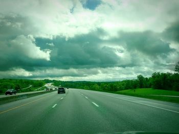 View of road against cloudy sky