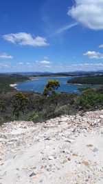 Scenic view of beach against blue sky