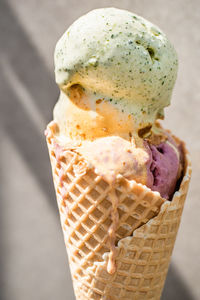 Multi-colored ice cream in a cone close-up. summer food