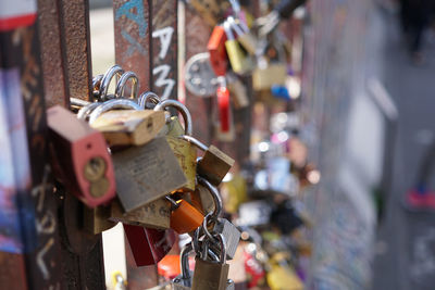 Close-up on the love padlocks mounted by a bridge. selective focus