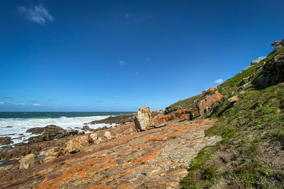 Scenic view of sea against blue sky
