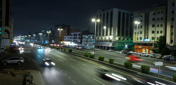 Traffic on road in city at night