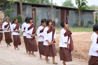 Group of people walking outdoors