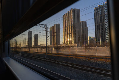 Railroad tracks seen through train window