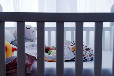 Baby girl sleeping in crib at home