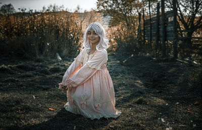 Woman standing in a forest