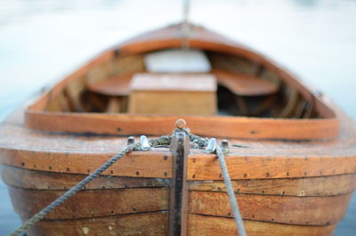Close-up of rope tied on wooden rowboat