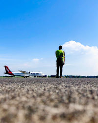 Rear view of man at runway