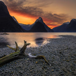 Scenic view of lake against sky during sunset