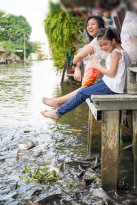 Young couple sitting in water