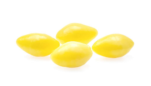 Close-up of yellow over white background