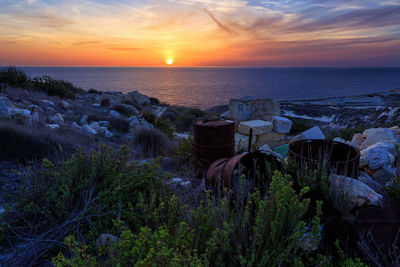 Scenic view of sea against sky during sunset