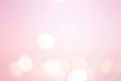 Defocused image of pink lights against sky
