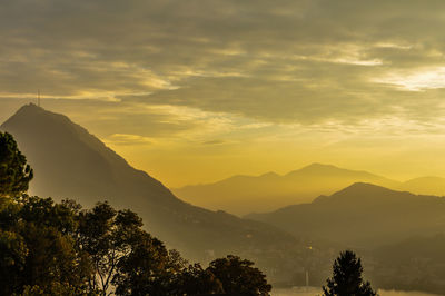 Scenic view of mountains at sunset