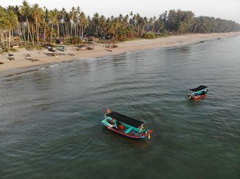 High angle view of people in boat on water