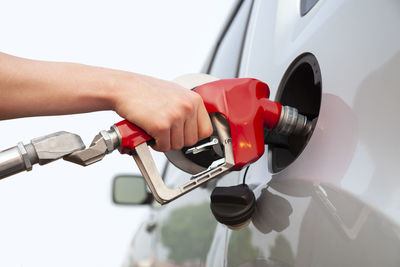 Cropped hand of man repairing car