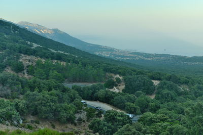 High angle view of trees and mountains against sky