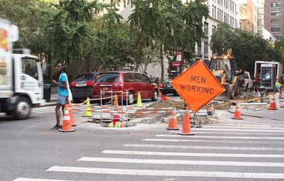 Road sign on street in city