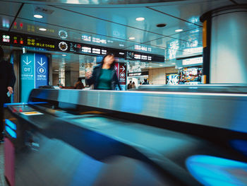 Blurred motion of train at railroad station