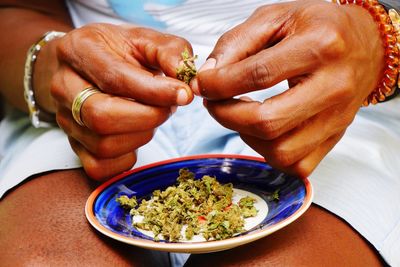 Close-up of man eating food