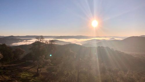 Scenic view of mountains against sky during sunset