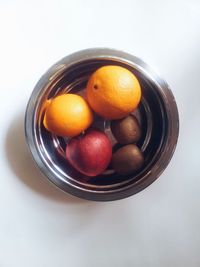 Close-up of fruit over white background