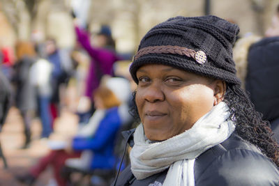 Close-up portrait of woman wearing knit hat