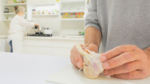 Senior couple preparing food at home