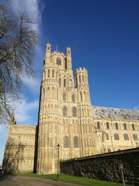 Low angle view of historical building against blue sky