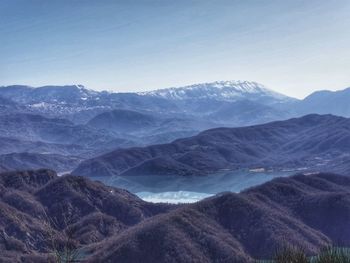 Scenic view of snowcapped mountains against sky