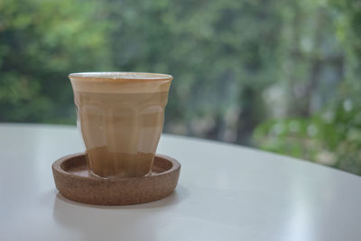 Close-up of coffee cup on table