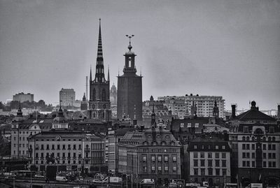 View of buildings in city against sky