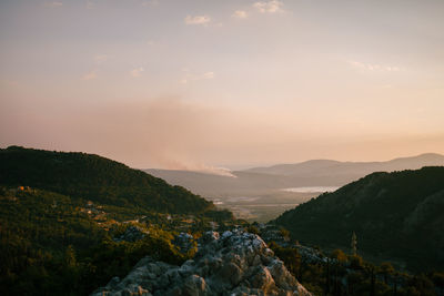 Scenic view of mountains against sky during sunset