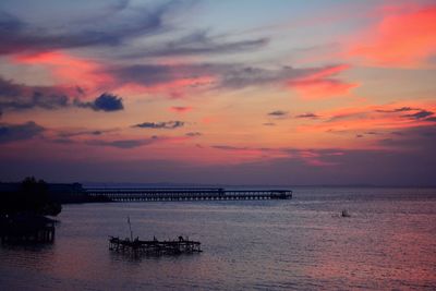 Scenic view of sea against orange sky