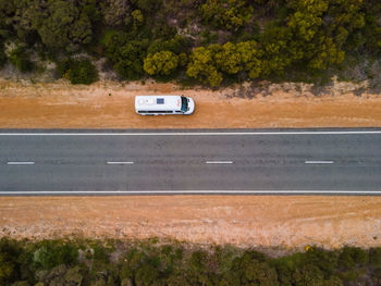 Car on road by trees