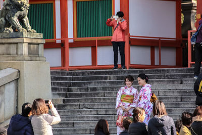 Full length of woman photographing