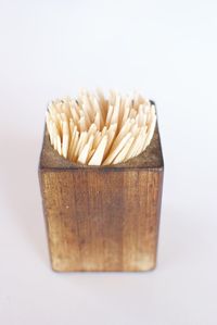 Close-up of bread over white background