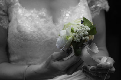 Close-up of hand holding bouquet
