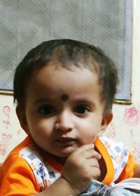 Close-up portrait of cute baby at home