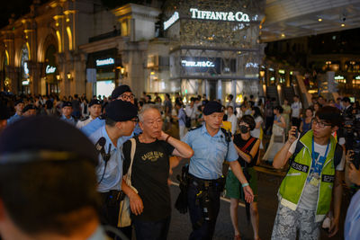 People on street in city at night