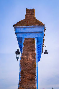 Low angle view of built structure against blue sky