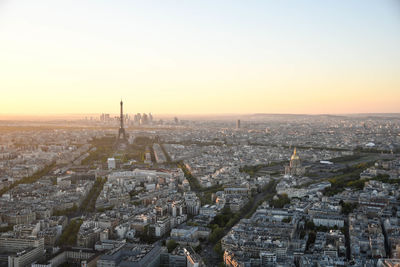 Aerial view of cityscape against sky during sunset