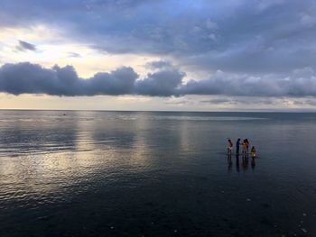 Scenic view of sea against cloudy sky