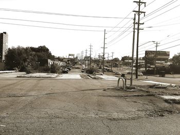 Rear view of people walking on road