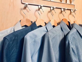 Shirts hanging on coat hook at home