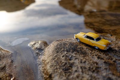 Close-up of toy car on rock