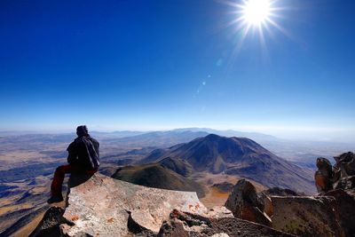 Scenic view of mountains against clear blue sky