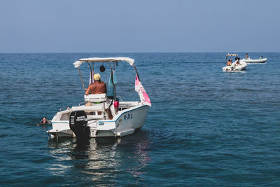 Ship in sea against clear sky