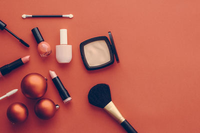 High angle view of beauty products on yellow background